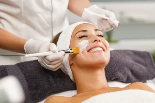 Client having a facial treatment